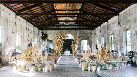 Coastal Heritage Society. a large room with wood rafters