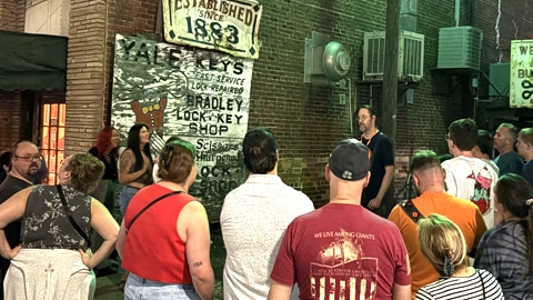 Cobblestone Tours. what looks to be a group of people in front of a tour guide