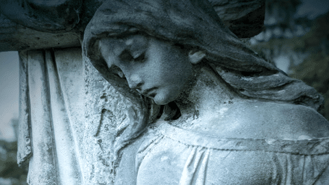 A stone statue of an angel's head