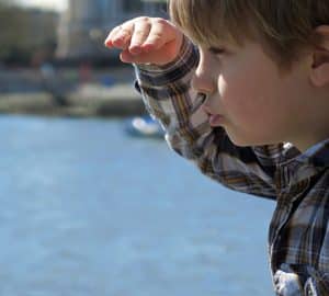 Kid-Friendly Activities in Savannah. a boy looking over water