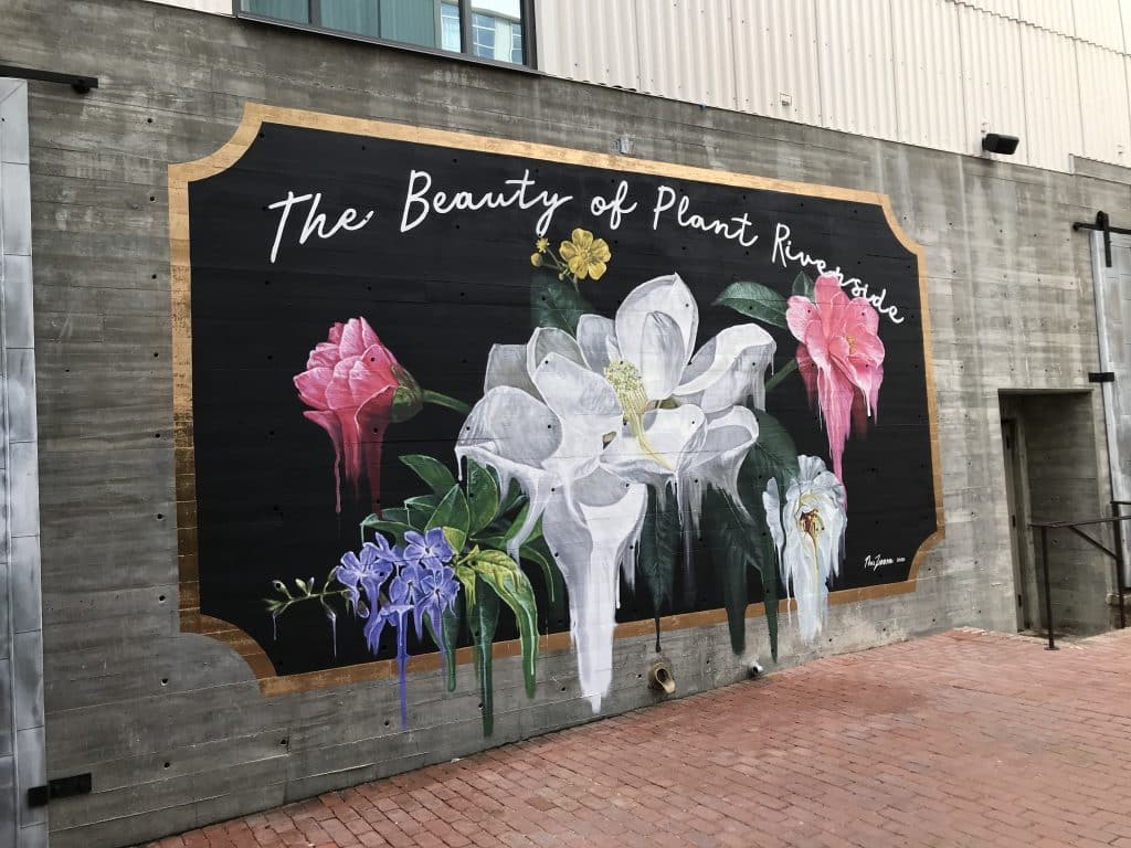 The Creative Spirit That Defines Savannah. a mural with flowers.