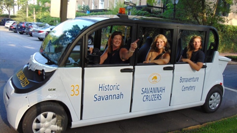 Historic District Electric Car Tours.Savannah and Bonaventure Cemetery tours written on the side of a car
