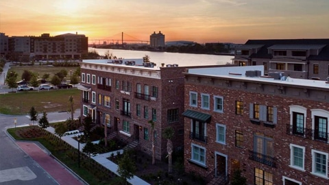 Upper East River. a group of brick buildings