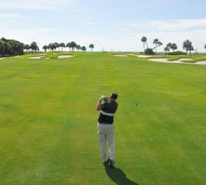 Swinging the Club wide, green golf course