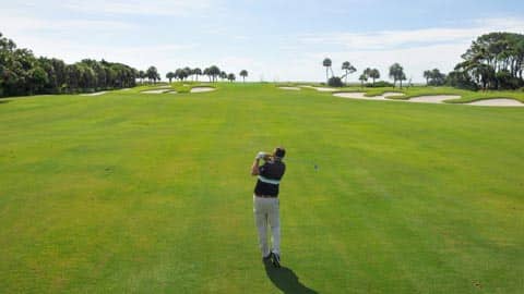 Swinging the Club wide, green golf course