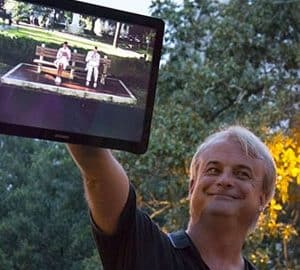 Haunting Evidence of Savannah’s. man holding up a laptop screen