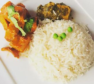 Nepalese Fusion Cuisine. a white plate with food