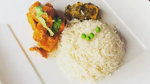 Nepalese Fusion Cuisine. a white plate with food