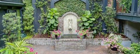 southern Belle Vacation Rentals mermaid fountain in garden